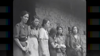 Six Asian women line up against a wall. Three women are looking at the camera with apprehensive expressions, and three are looking away. The photo is blurry and in black and white.