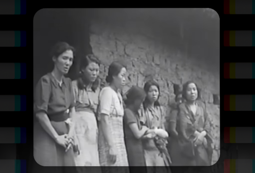 Six Asian women line up against a wall. Three women are looking at the camera with apprehensive expressions, and three are looking away. The photo is blurry and in black and white.