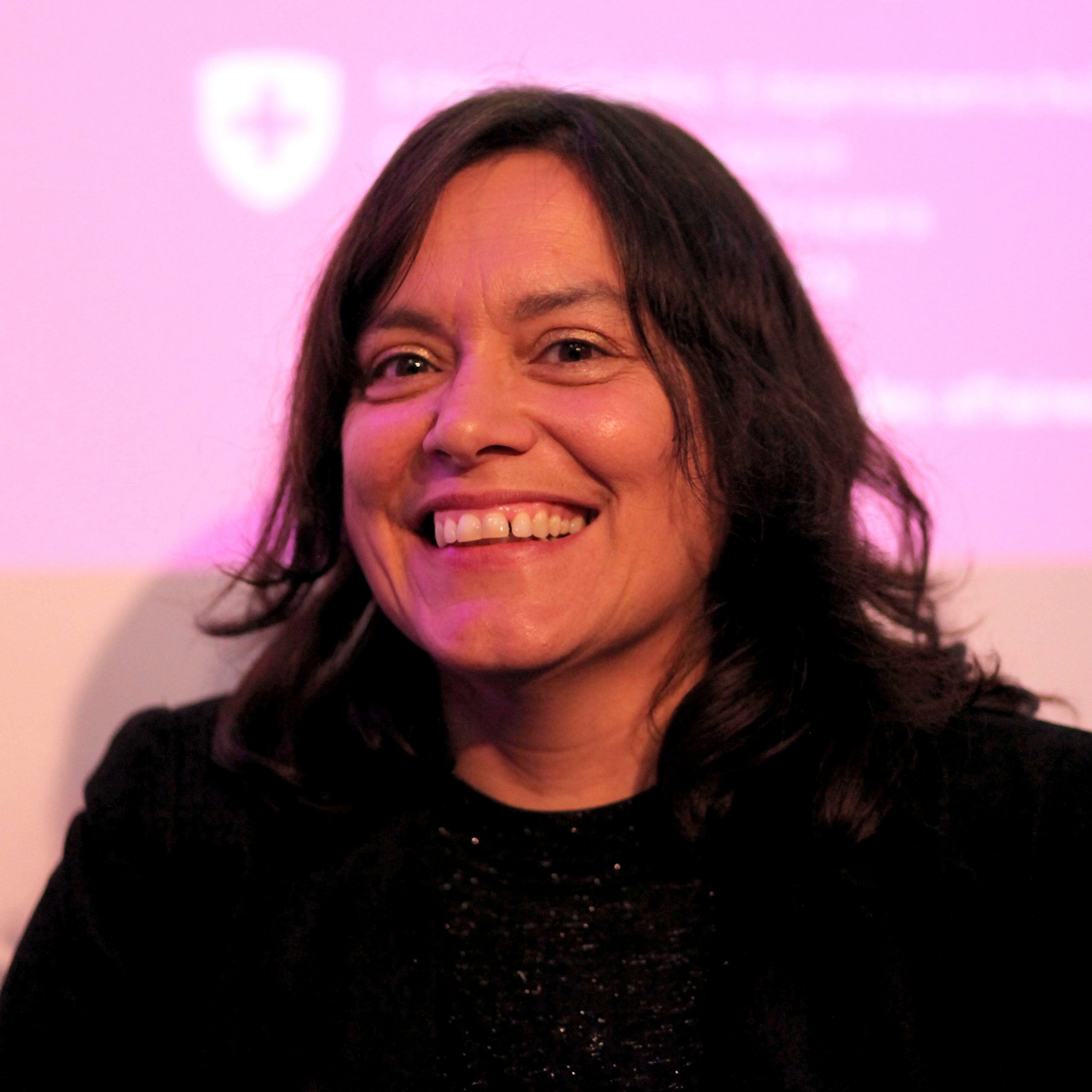 A photograph of author Sara Ahmed smiling.