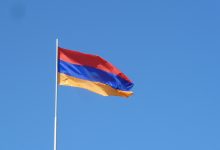 A photo of the Armenian flag flying.