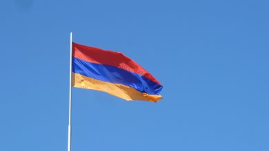 A photo of the Armenian flag flying.